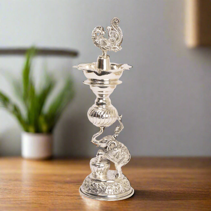 Timeless Radiance: Silver-Coated Brass Elephant and Peacock Oil Lamp